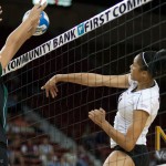 Des Scott tries to power the ball throught the Wahine defense