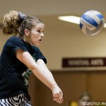 A Cloudcroft player digs the ball